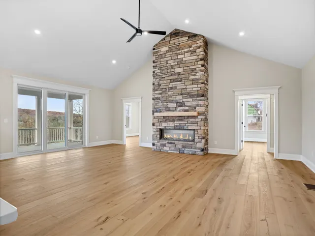 a large kitchen with kitchen island a sink stainless steel appliances and cabinets