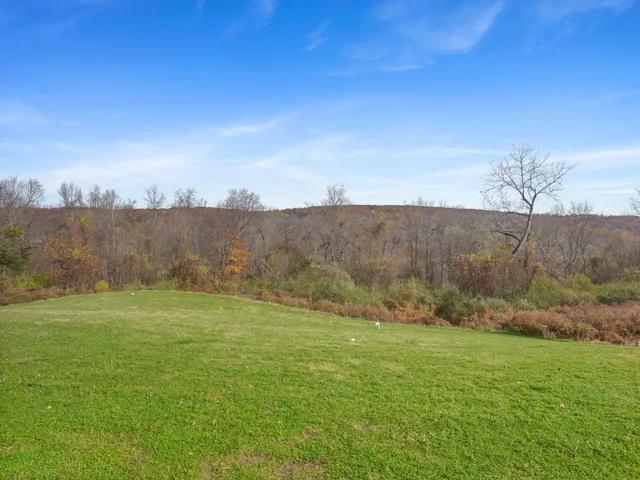 a view of a field with an outdoor space