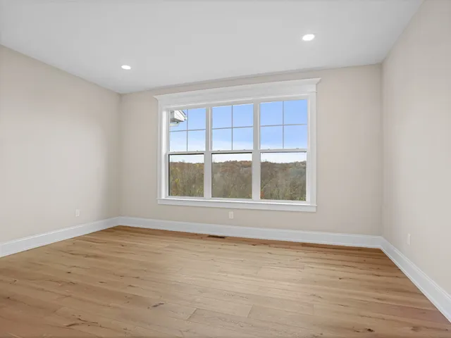 a bathroom with double vanity sink and a mirror