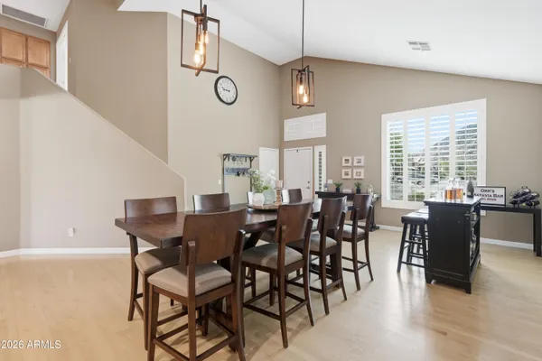 a view of a dining room with furniture window and wooden floor