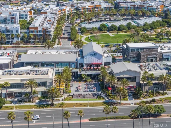 an aerial view of residential building and ocean
