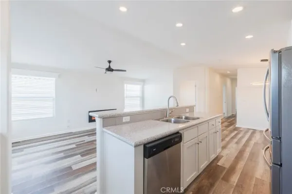 a kitchen with a sink stove and cabinets