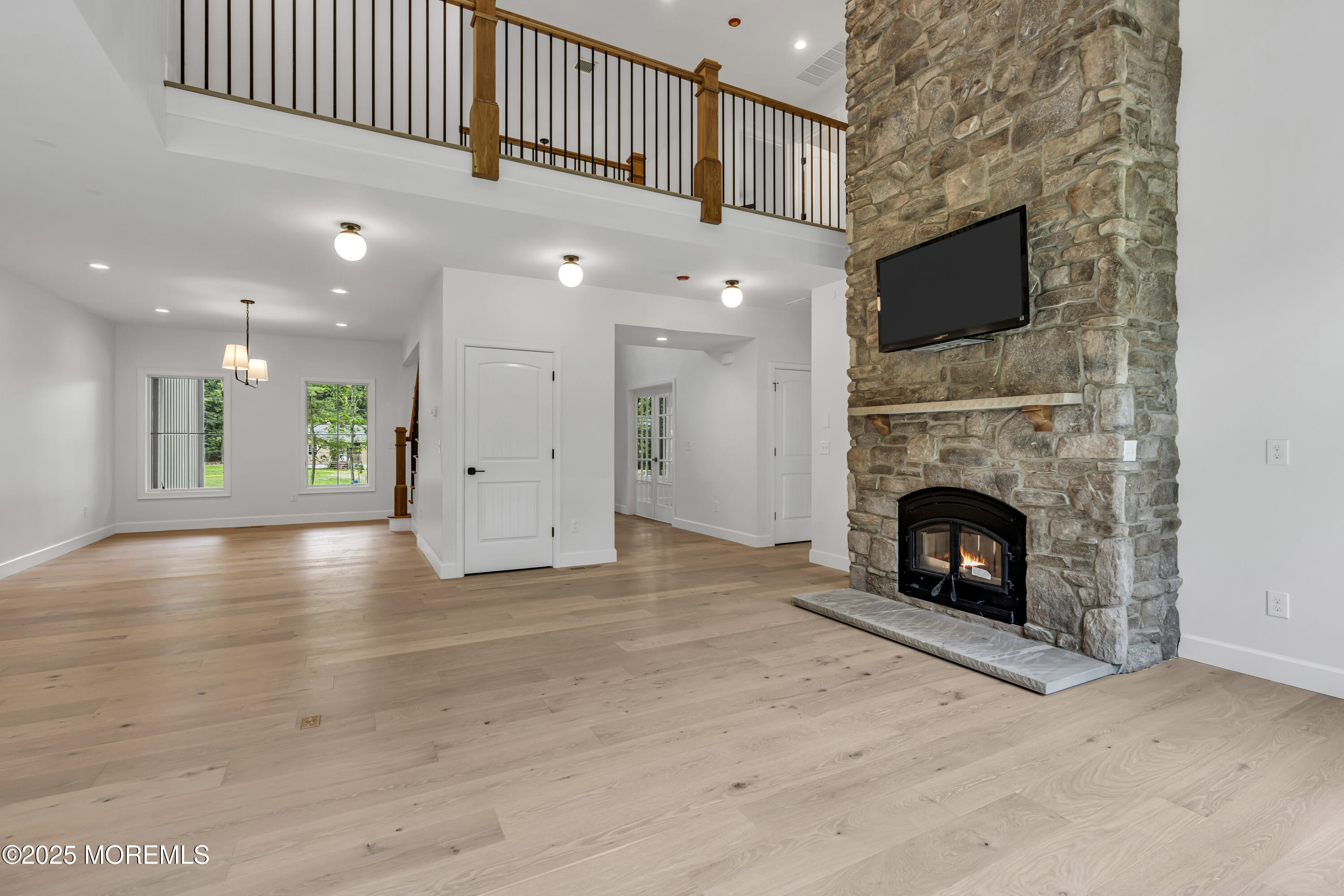 379 Buckalew Road Freehold, NJ 07728 - Photo 16 of 83 a view of a livingroom with a fireplace a fireplace and a window