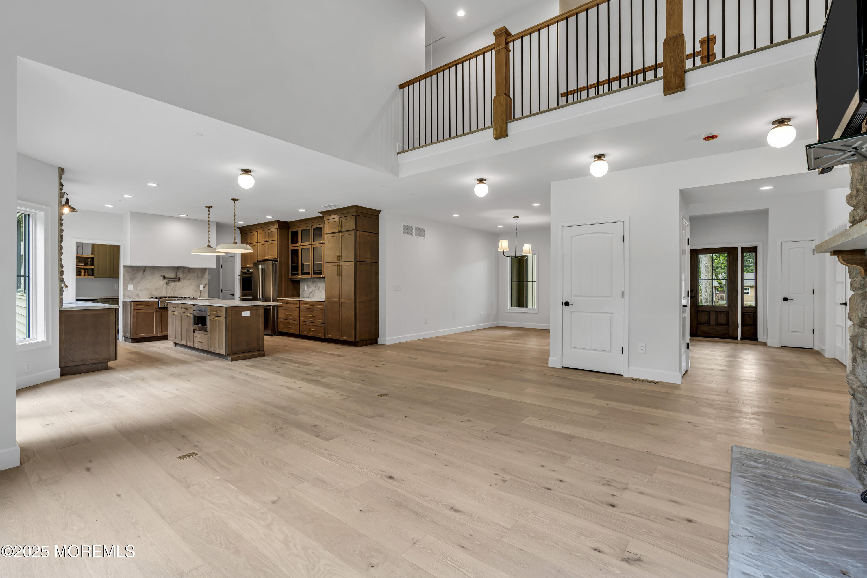 379 Buckalew Road Freehold, NJ 07728 - Photo 17 of 83 a view of a kitchen with a refrigerator and a kitchen island