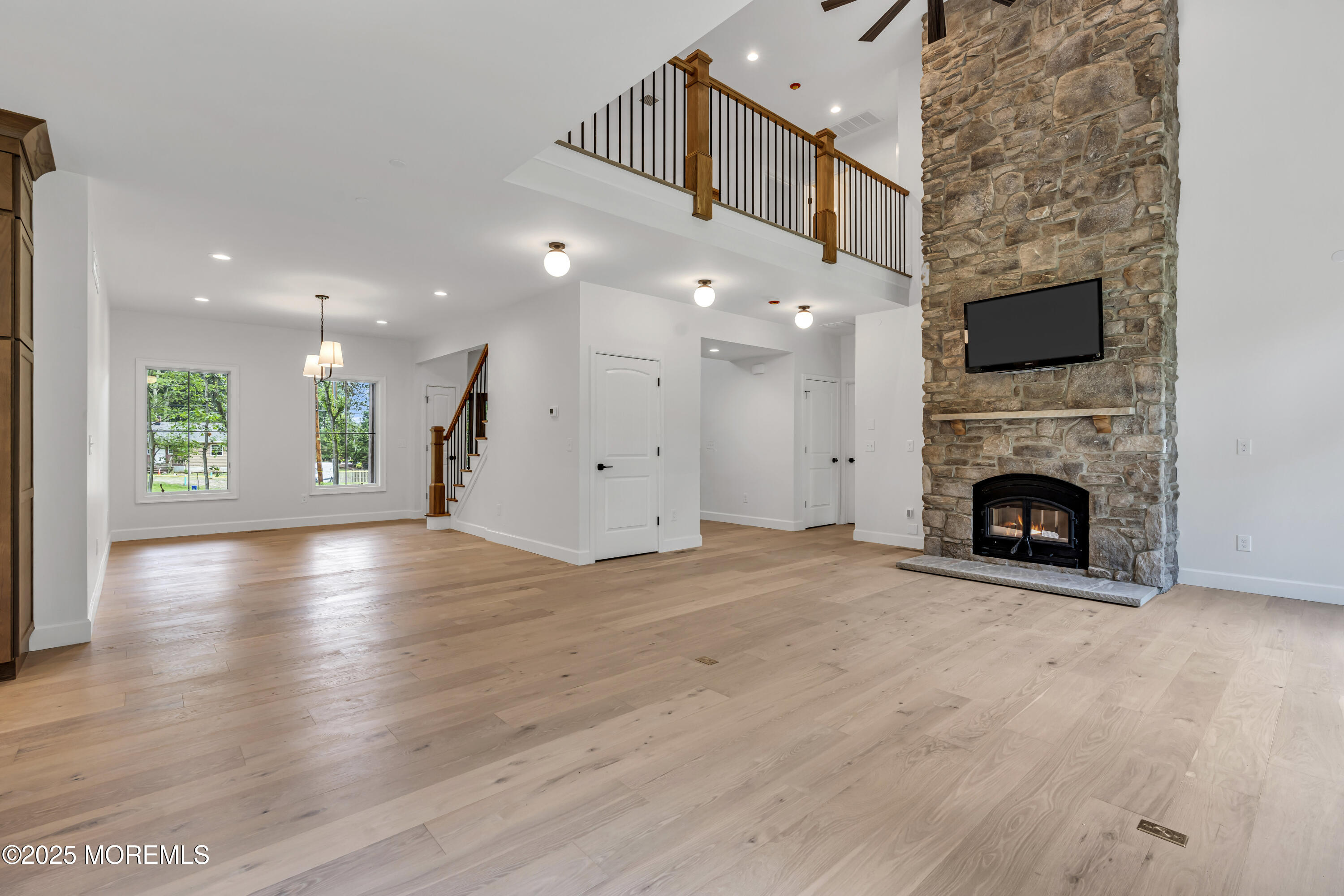 379 Buckalew Road Freehold, NJ 07728 - Photo 24 of 83 a view of a livingroom with wooden floor and a fireplace