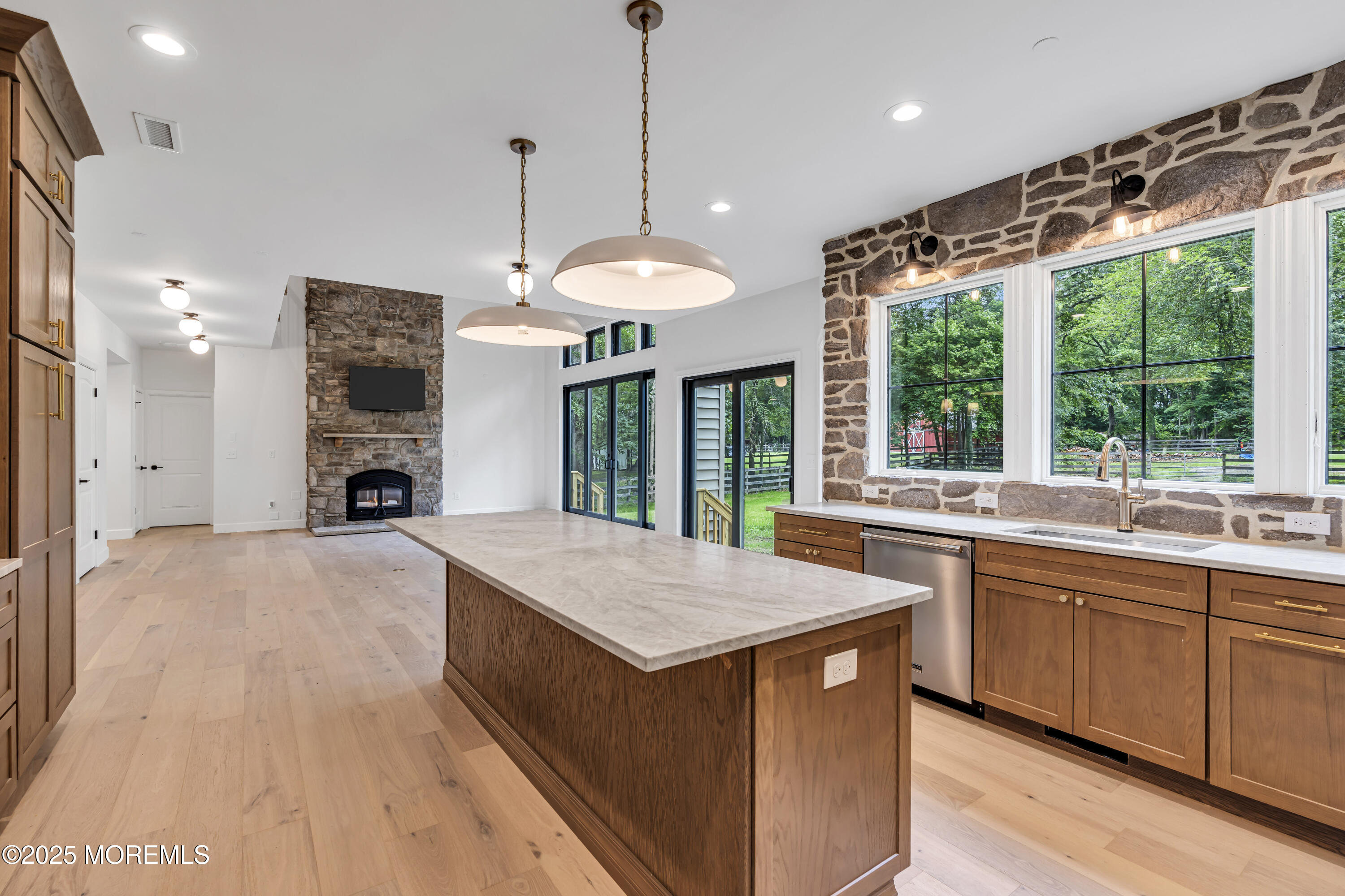 379 Buckalew Road Freehold, NJ 07728 - Photo 32 of 83 a open kitchen with stainless steel appliances granite countertop a sink a stove and a wooden floors