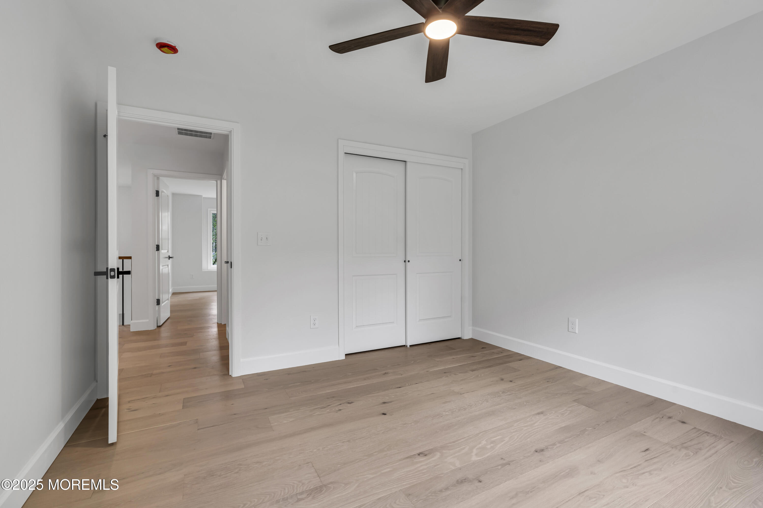 379 Buckalew Road Freehold, NJ 07728 - Photo 49 of 83 wooden floor in an empty room