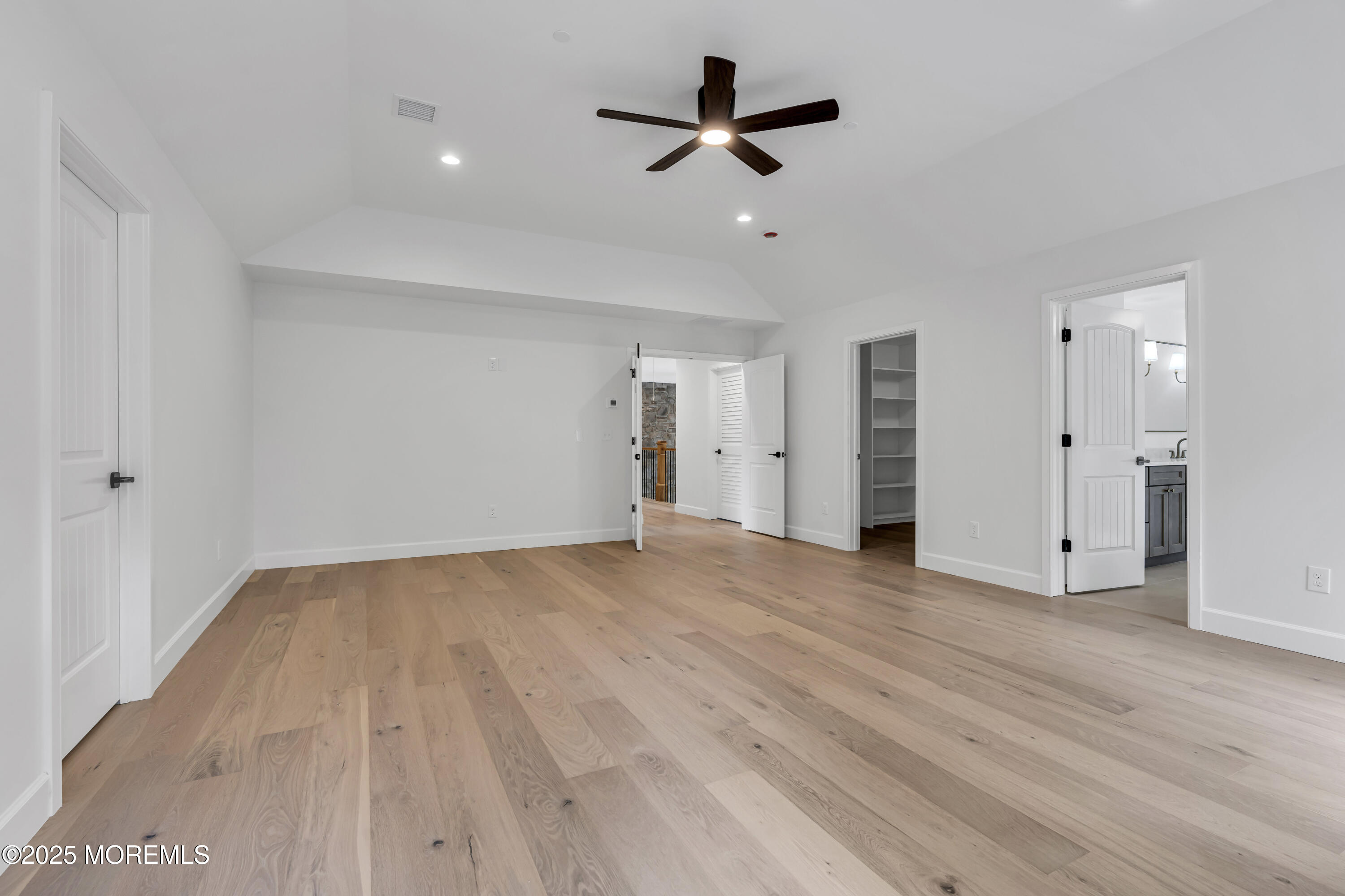 379 Buckalew Road Freehold, NJ 07728 - Photo 58 of 83 a view of empty room with wooden floor and ceiling fan