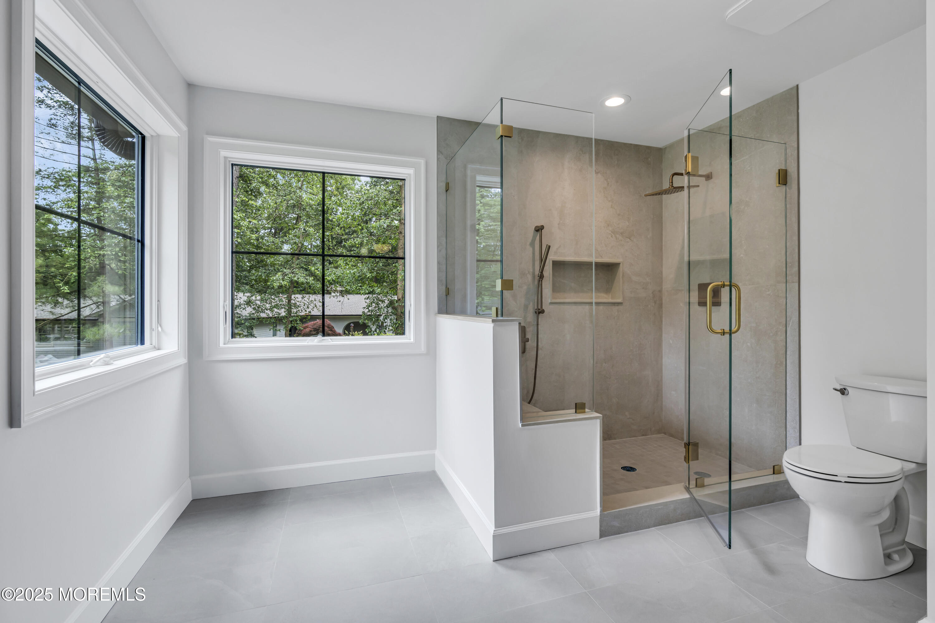 379 Buckalew Road Freehold, NJ 07728 - Photo 64 of 83 a bathroom with a glass shower door and a toilet