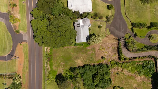 an aerial view of residential houses with outdoor space