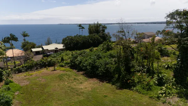 a view of a lake with a yard