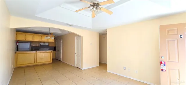 a kitchen with a refrigerator and a sink