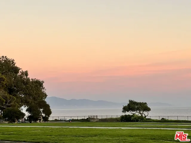 a large kitchen with stainless steel appliances lots of counter space and a sink