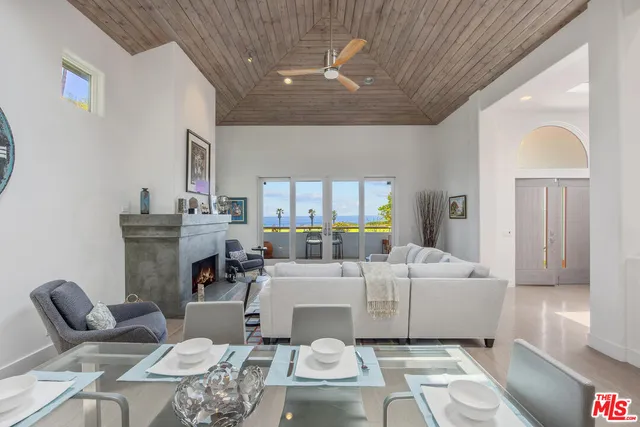 a kitchen with stainless steel appliances kitchen island granite countertop a refrigerator stove top oven and sink