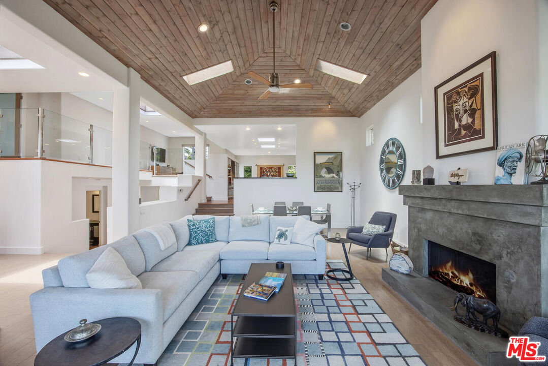 1312 Shoreline Drive Santa Barbara, CA 93109 - Photo 16 of 67 a living room with furniture and a fireplace