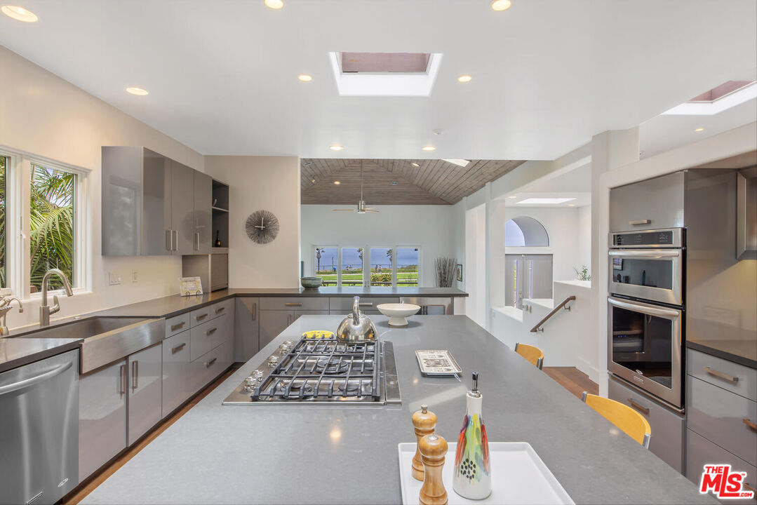 1312 Shoreline Drive Santa Barbara, CA 93109 - Photo 19 of 67 a large kitchen with stainless steel appliances lots of counter space and a sink