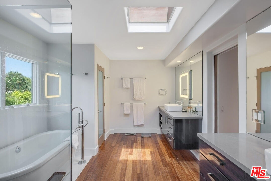 1312 Shoreline Drive Santa Barbara, CA 93109 - Photo 31 of 67 a spacious bathroom with a tub sink shower and mirror