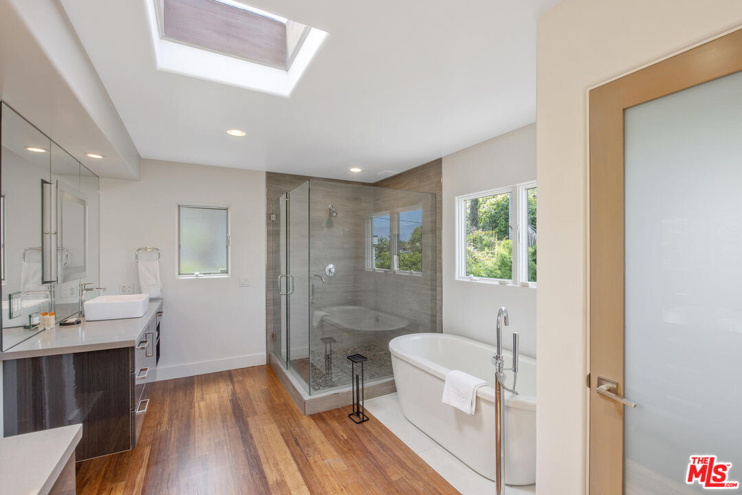 1312 Shoreline Drive Santa Barbara, CA 93109 - Photo 32 of 67 a spacious bathroom with a double vanity sink a toilet and a shower
