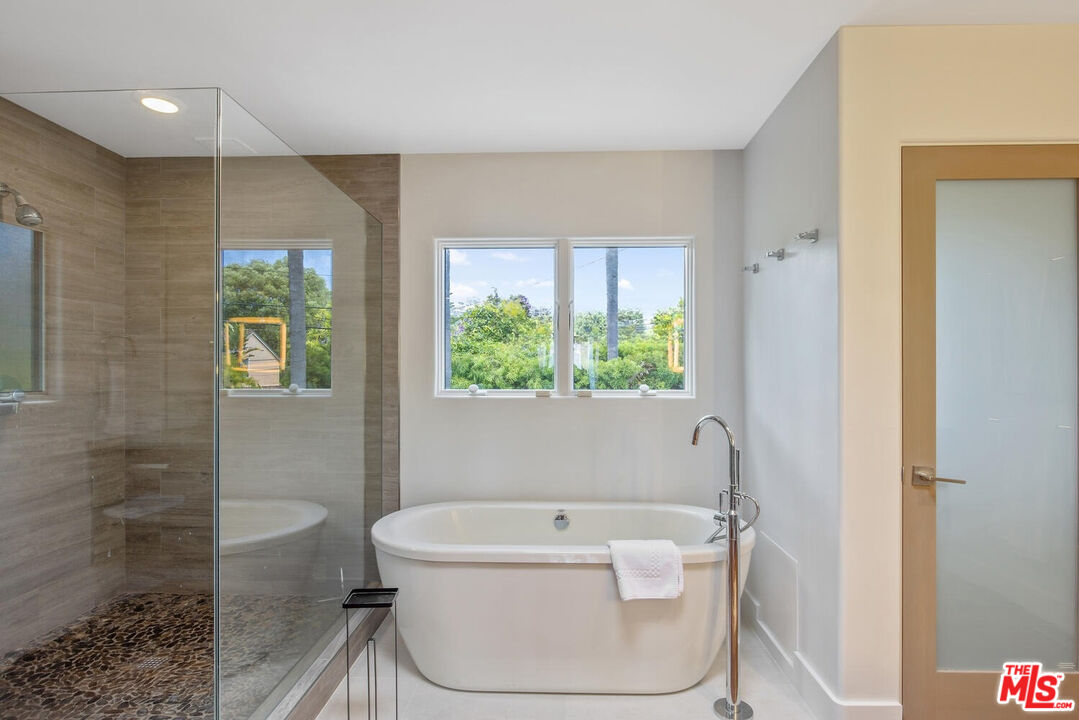 1312 Shoreline Drive Santa Barbara, CA 93109 - Photo 33 of 67 a bath tub sitting in a bathroom next to a toilet