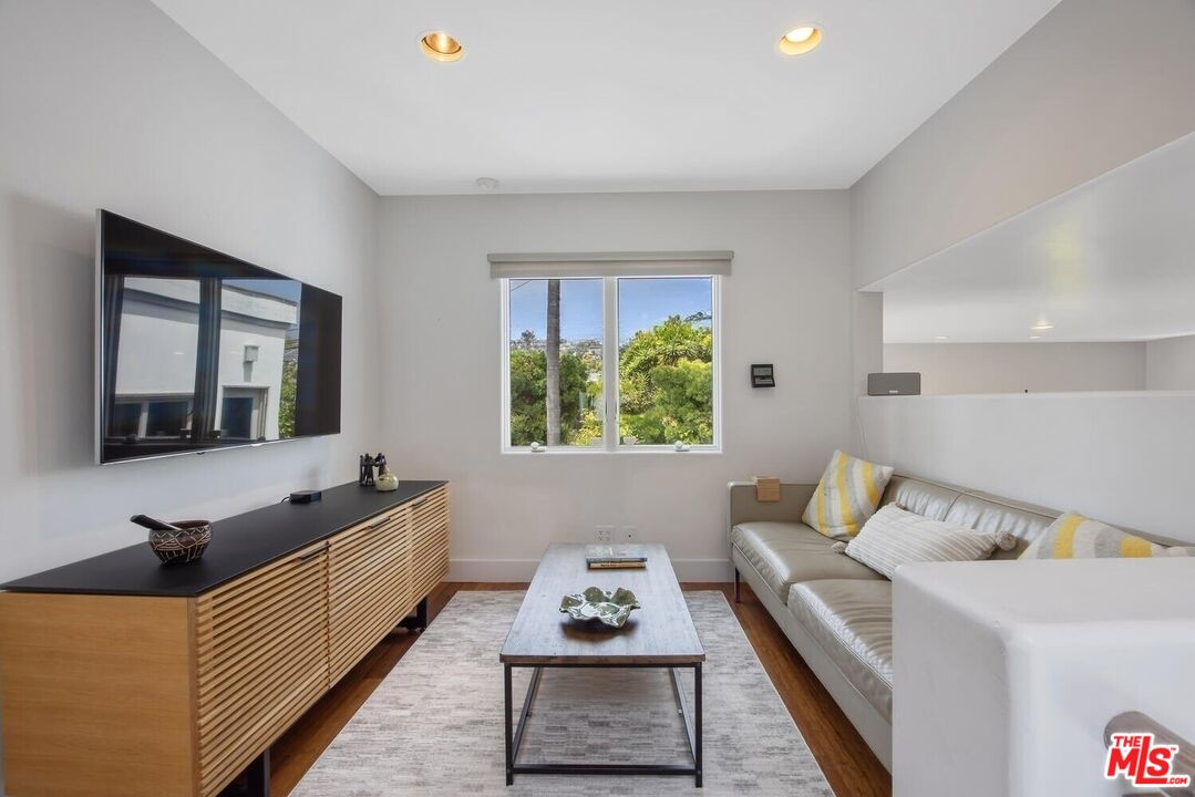 1312 Shoreline Drive Santa Barbara, CA 93109 - Photo 36 of 67 a living room with furniture and a window
