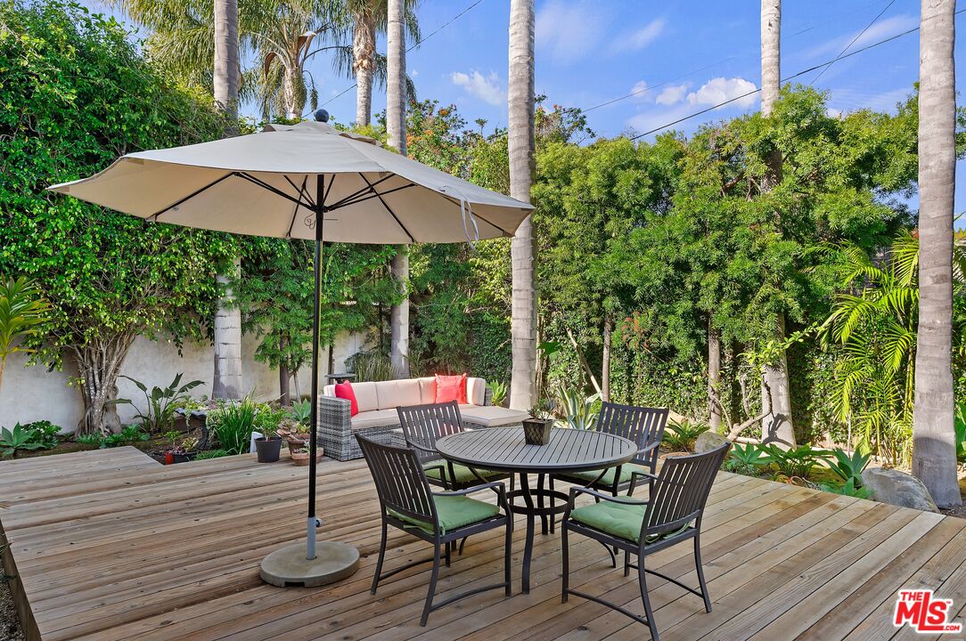1312 Shoreline Drive Santa Barbara, CA 93109 - Photo 40 of 67 a view of a patio with table and chairs under an umbrella