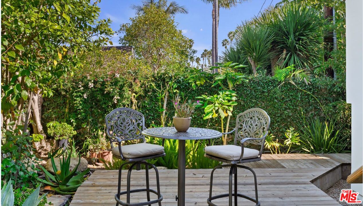 1312 Shoreline Drive Santa Barbara, CA 93109 - Photo 41 of 67 a backyard of a house with table and chairs