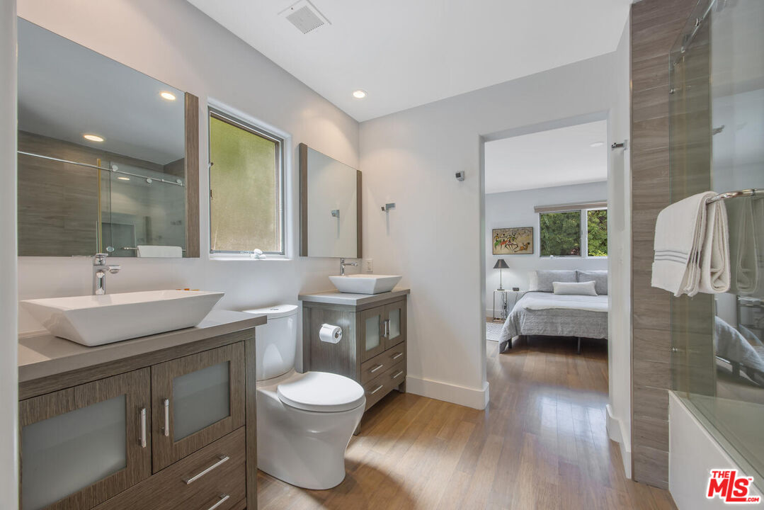 1312 Shoreline Drive Santa Barbara, CA 93109 - Photo 49 of 67 a spacious bathroom with a sink a toilet and a mirror
