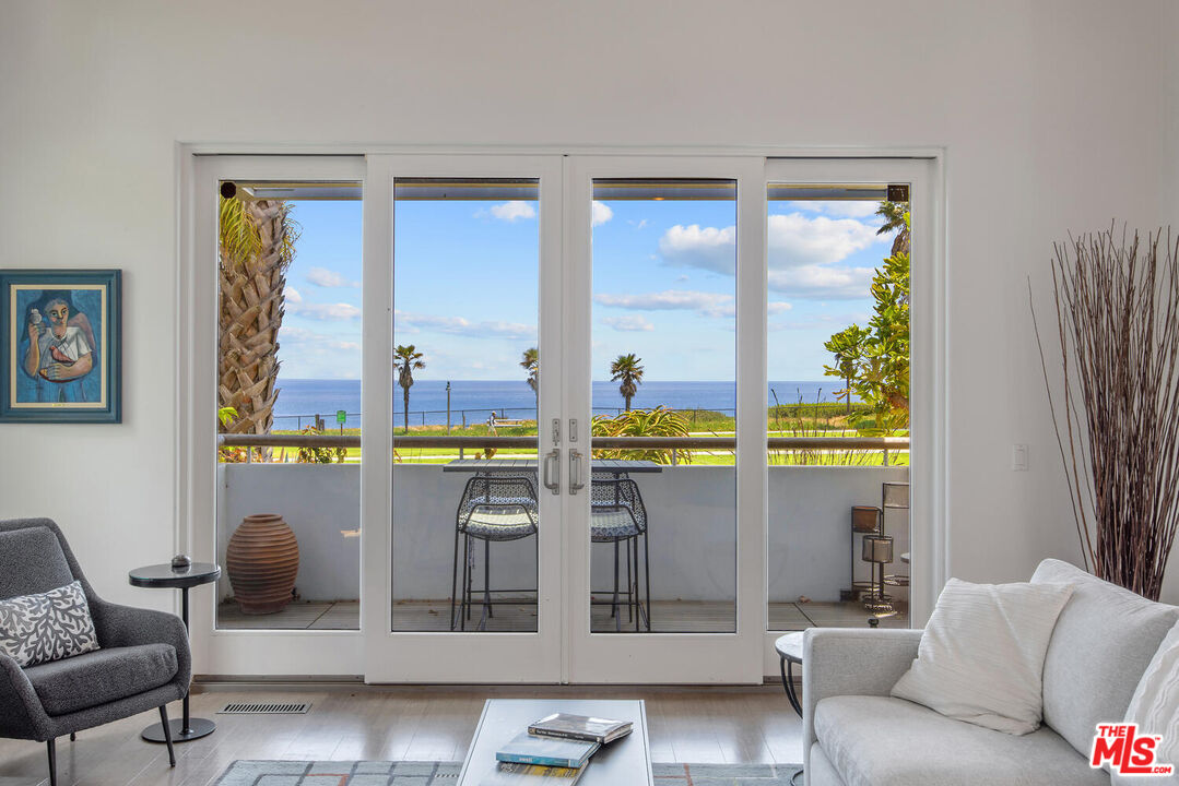 1312 Shoreline Drive Santa Barbara, CA 93109 - Photo 5 of 67 a living room with furniture and a window