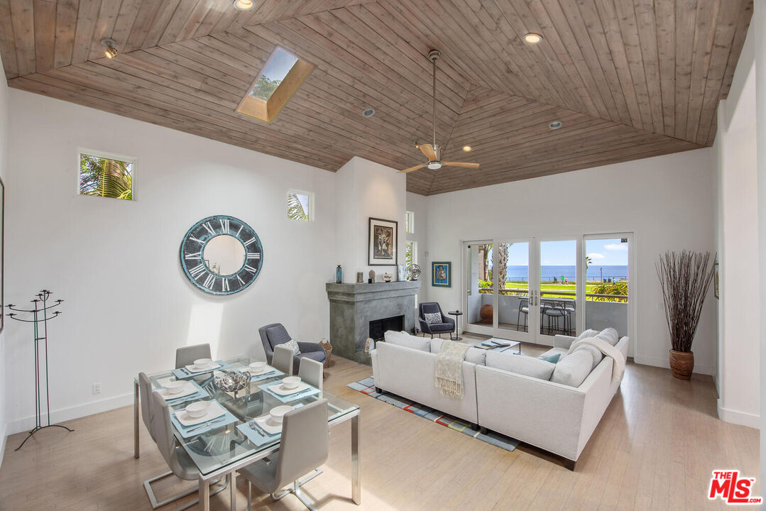 1312 Shoreline Drive Santa Barbara, CA 93109 - Photo 55 of 67 a living room with furniture a window and a clock