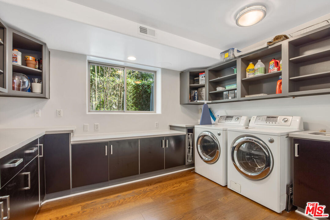 1312 Shoreline Drive Santa Barbara, CA 93109 - Photo 56 of 67 a view of a kitchen with washer and dryer