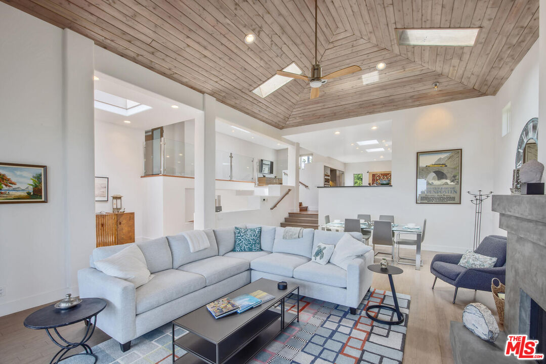 1312 Shoreline Drive Santa Barbara, CA 93109 - Photo 10 of 67 a living room with furniture kitchen view and a chandelier
