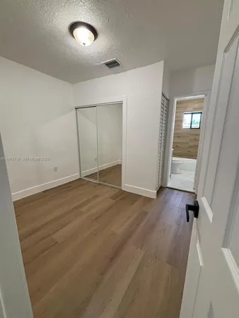 a bathroom with a toilet a sink and bathtub