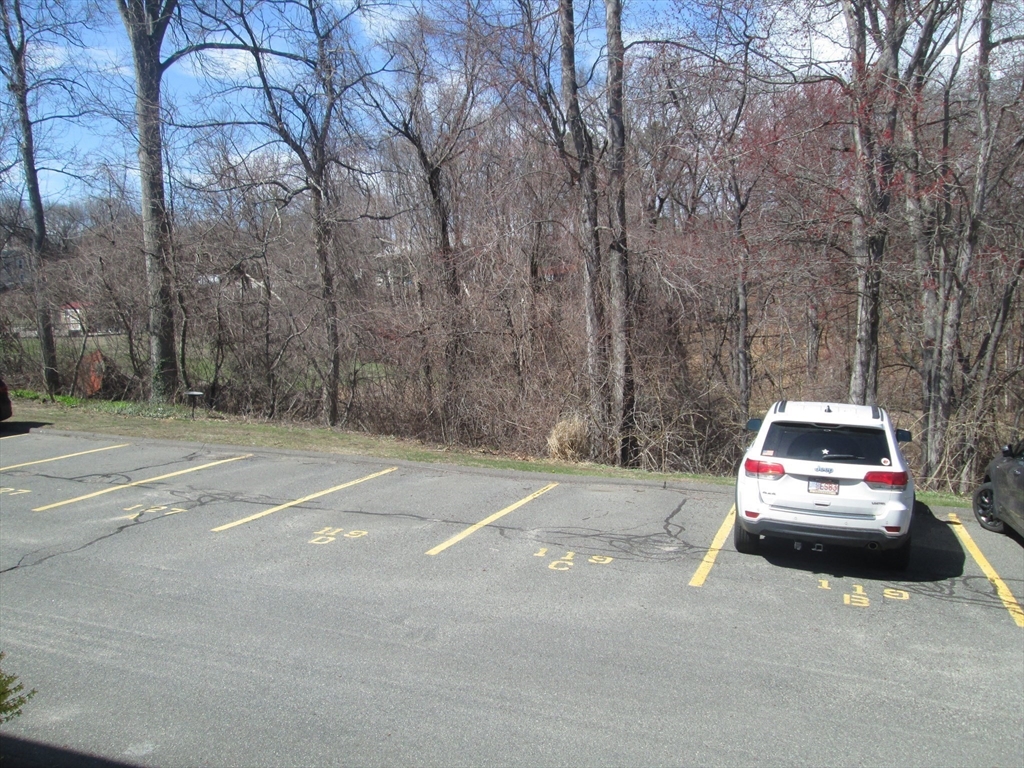119 Colonial Circle, Unit B Chicopee, MA 01020 - Photo 13 of 17 a car parked on the side of the road