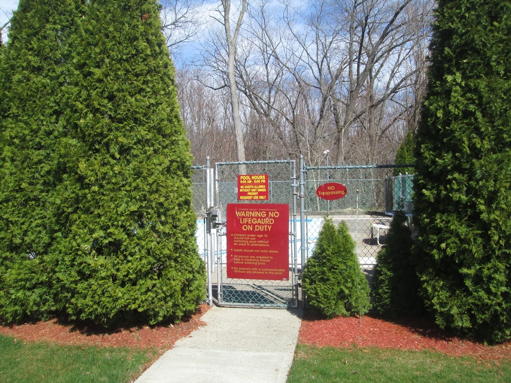 119 Colonial Circle, Unit B Chicopee, MA 01020 - Photo 16 of 17 a sign that is sitting on a brick wall
