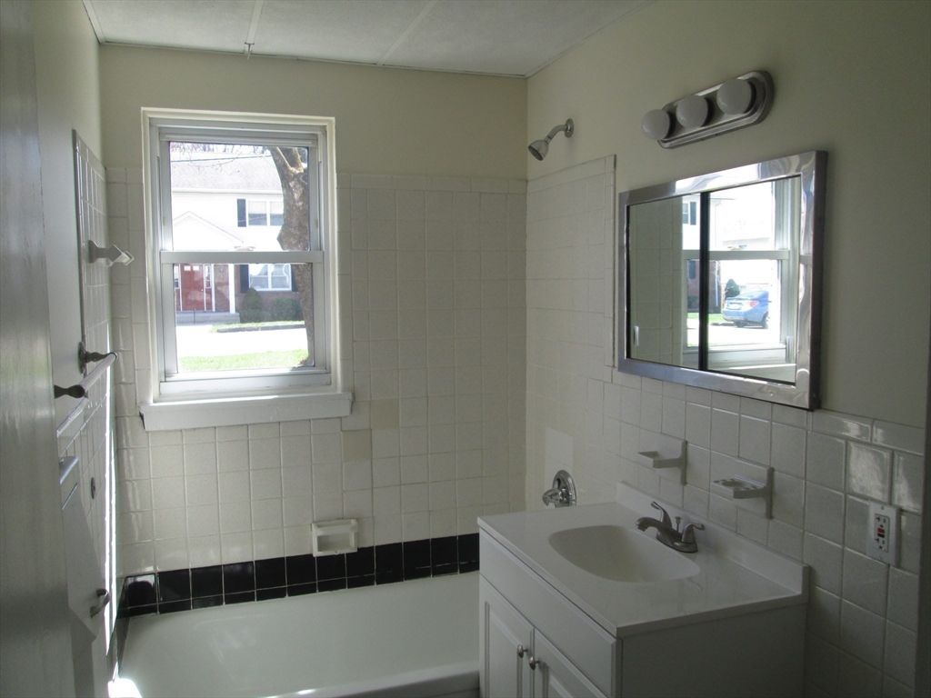 119 Colonial Circle, Unit B Chicopee, MA 01020 - Photo 8 of 17 a bathroom with a sink and a bathtub