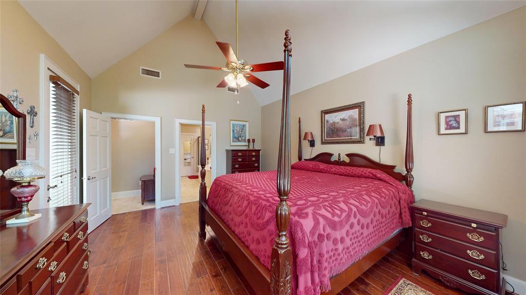 7451 County Road 1509 Athens, TX 75751 - Photo 10 of 36 a bed room with a bed and a ceiling fan
