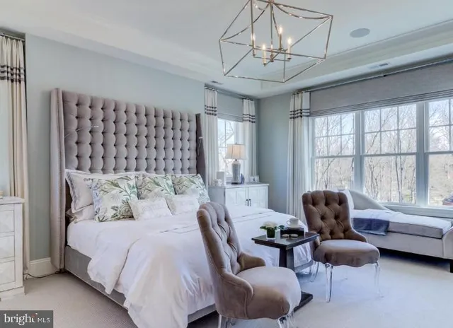 a bedroom with furniture and a window