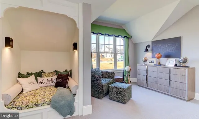 a bedroom with furniture and a window