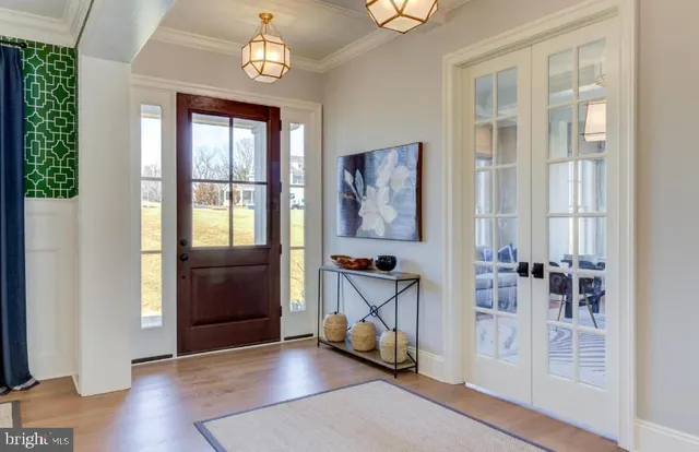 an entryway at livingroom with furniture and wooden floor