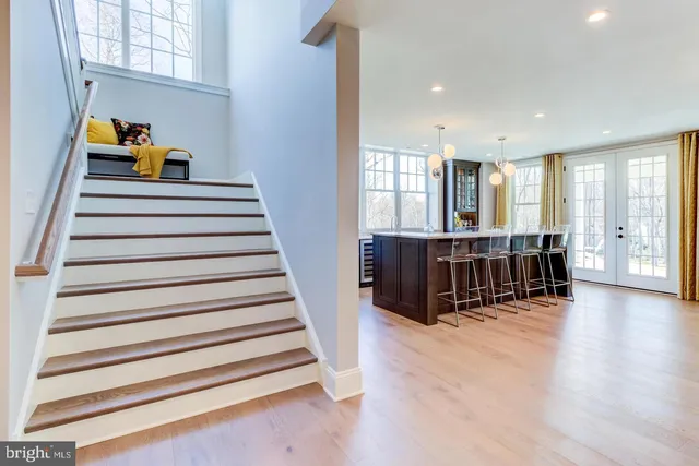 a view of entryway and hall with wooden floor
