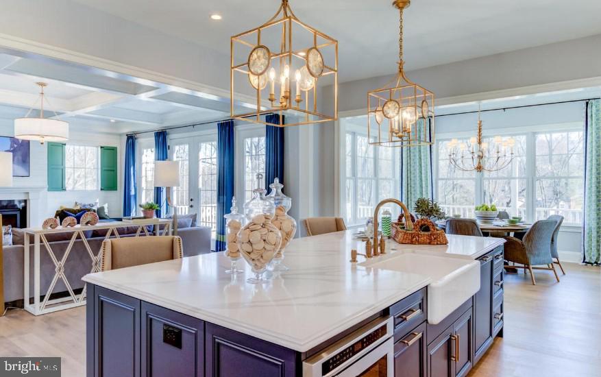 837 Nathan Hale Road Berwyn, PA 19312 - Photo 5 of 25 a view of a dining room and livingroom with furniture wooden floor a chandelier