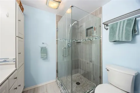 a bathroom with a shower and a sink