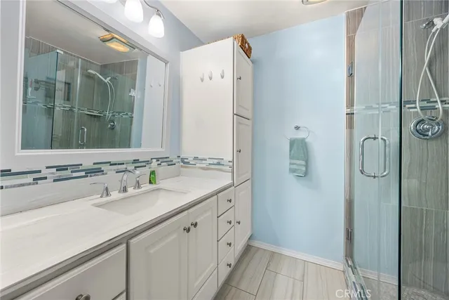 a bathroom with a double vanity sink and mirror
