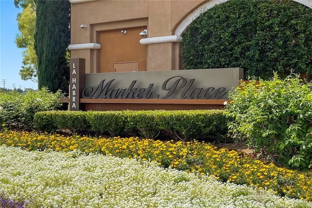 a view of a sign in front of house
