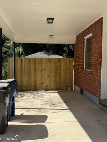a view of backyard with tub