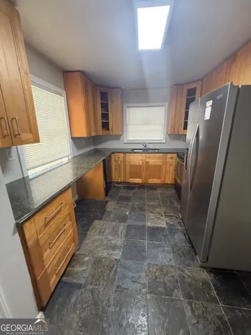 a bathroom with a tub sink and a mirror