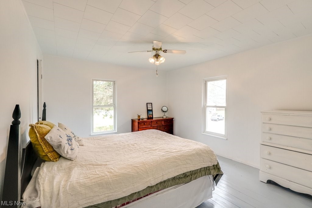 3196 Wadsworth Road Barberton, OH 44203 - Photo 27 of 49 Master bedroom with hardwood floors and ceiling fan