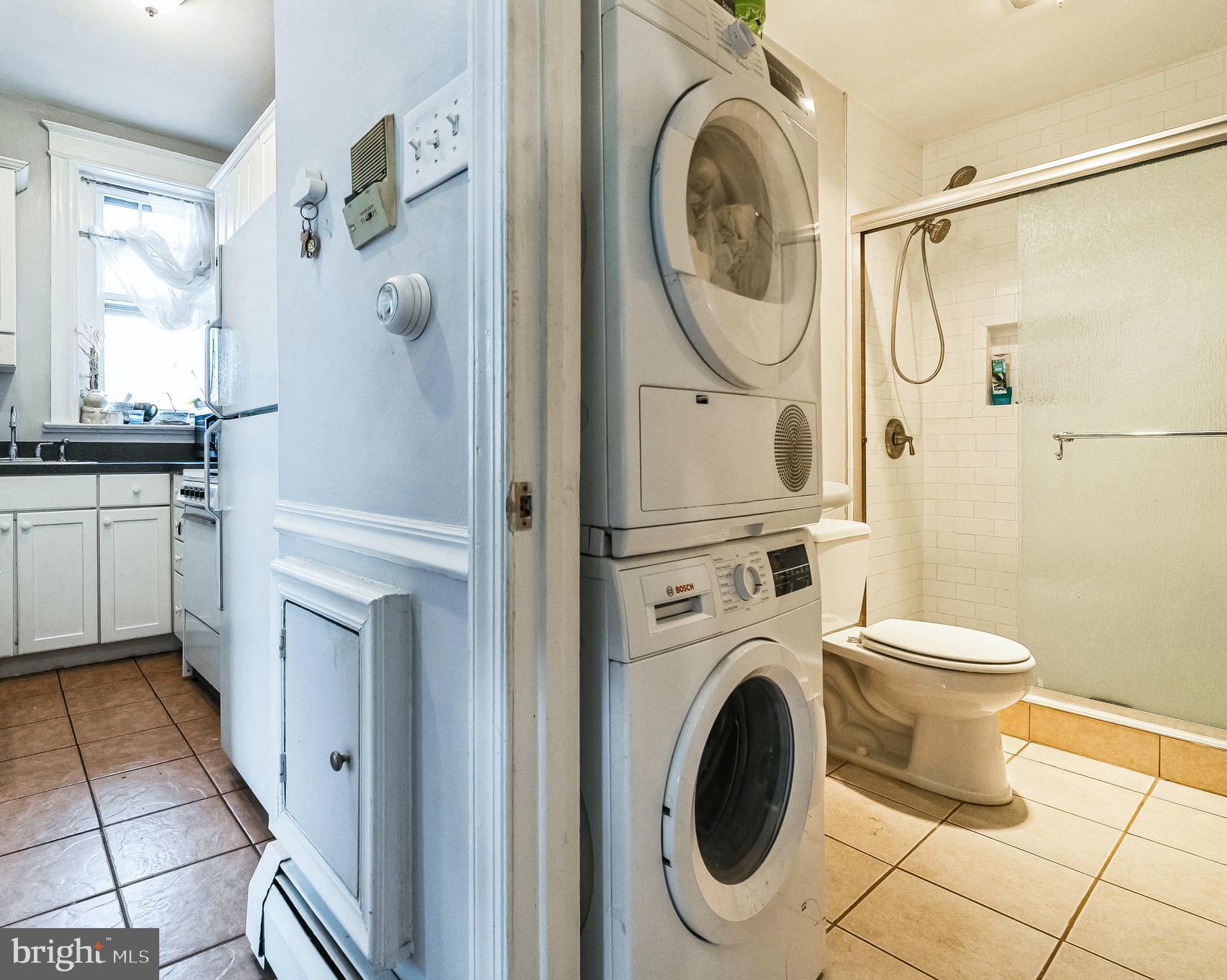 101 7th Street Southeast, Unit 4 Washington, DC 20003 - Photo 5 of 13 a bathroom with a sink a toilet and a shower