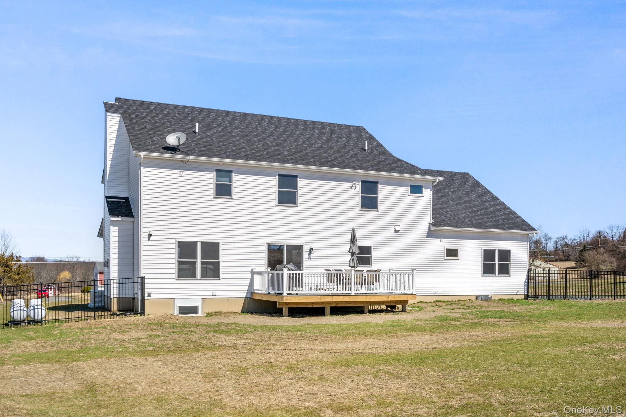 10 Harrier Ridge Drive Wallkill, NY 12589 - Photo 41 of 46 Back of property featuring a wooden deck and a shingled roof