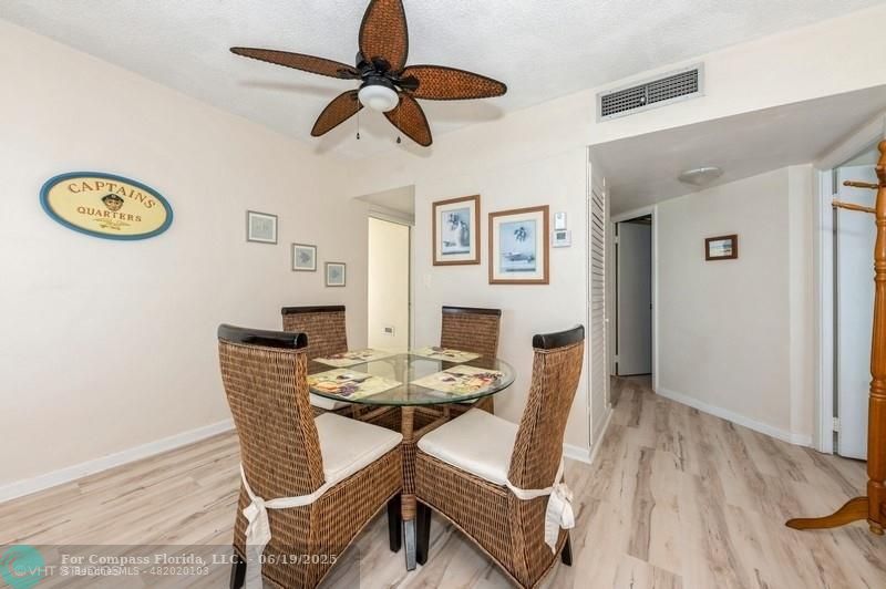 710 North Ocean Boulevard, Unit 1203 Pompano Beach, FL 33062 - Photo 11 of 23 a dining room with furniture and a table